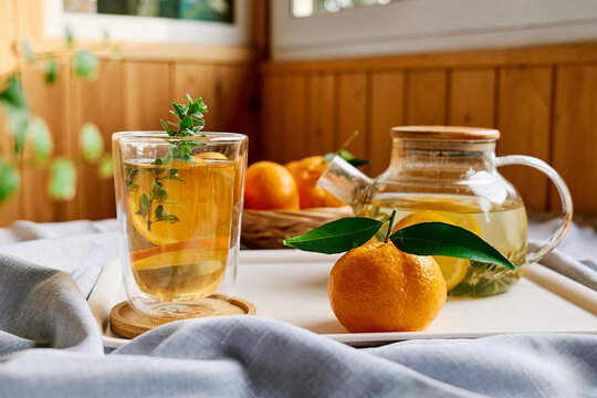 Citrus hot beverage in thermic glass on a table