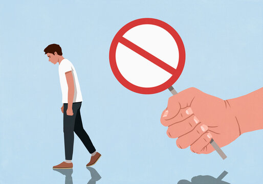 Fist with a Do Not Enter sign behind dejected man walking away