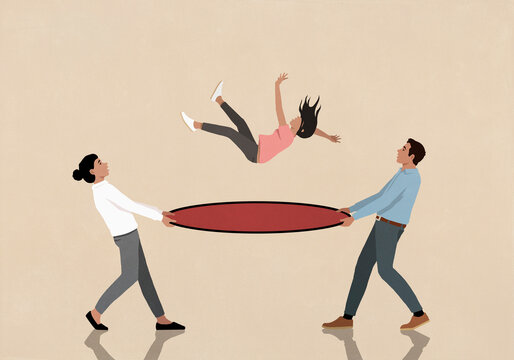 Parents holding safety net under falling daughter