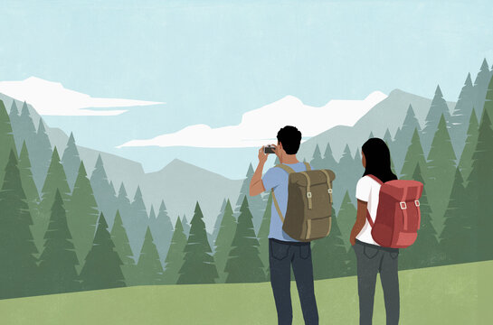 Couple with camera enjoying backpacking vacation, photographing scenic mountain view