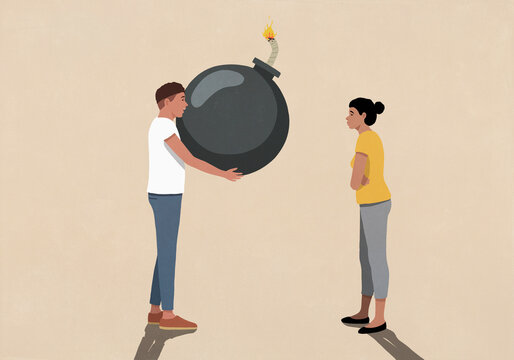 Man giving large bomb to girlfriend with arms crossed against beige background