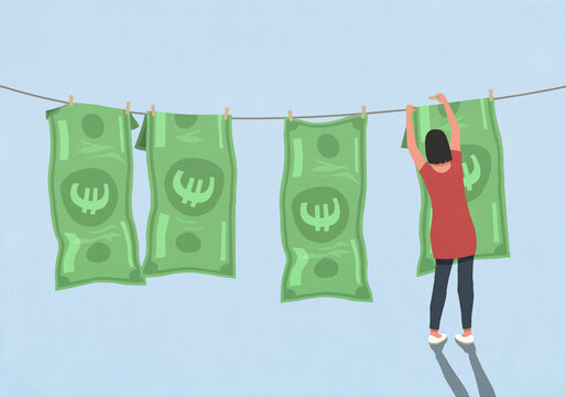 Woman hanging Euro bill on clothesline against blue background
