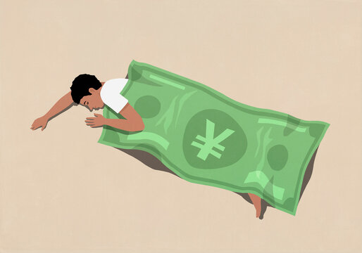 Man sleeping under green Chinese Yuan note blanket