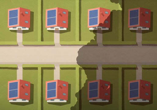 Aerial view of cloud shadow rows of identical houses with solar panels on rooftops