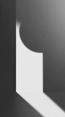 Abstract composition of geometric shapes with strong shadows and contrast, on black