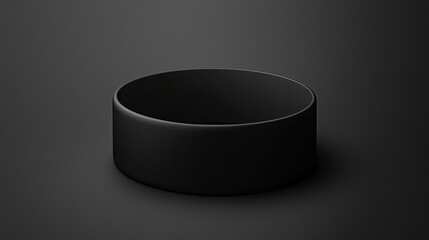 A black, empty bowl sits on a black background.