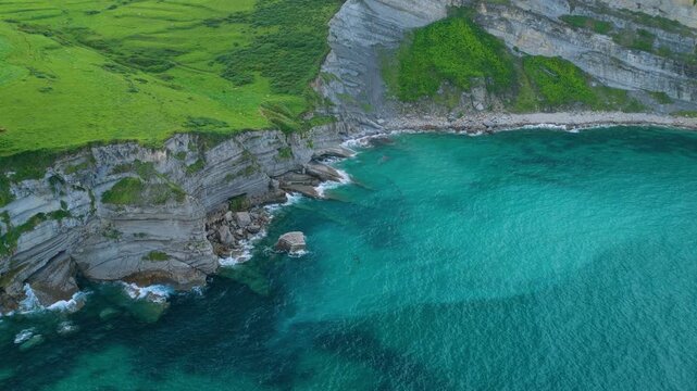 Aerial view from a drone of the coastline near Punta Ballota in the municipality of Suances. Cantabrian Sea. Cantabria. Spain. Europe