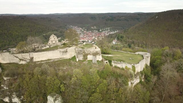 Epic 4K UHD drone pullback from Hohengundelfingen castle ruins, revealing the Lauter Valley and village below&mdash;perfect for travel promos, history docs, commercials.