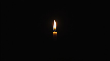 A single candle in the dark.