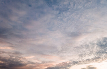 Obraz premium Panoramic view of sunset golden and blue sky nature background. Colorful dramatic sky with cloud at sunset.Sky background.Sky with clouds at sunset.