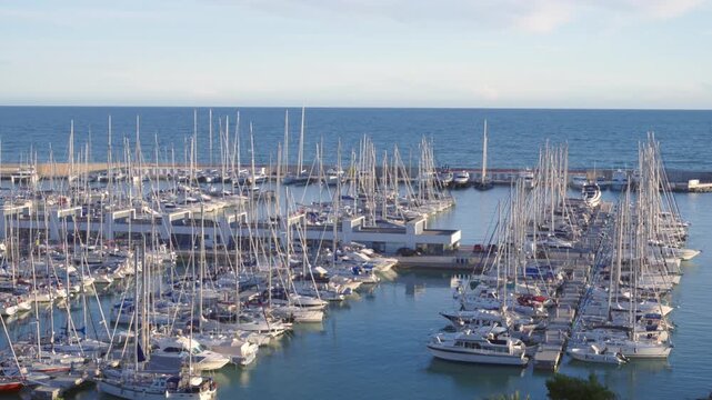 Sailboats and yachts moored in Port Ginesta marina