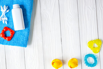 baby accessories for bath on wooden background