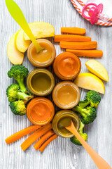 baby vegetable puree on wooden background top view