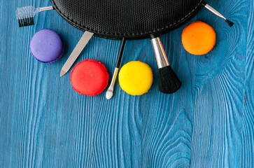 decorative cosmetics on wooden background top view