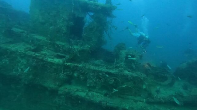 Shipwreck Dive Site in the Maldives with Scuba Divers Exploring the Wreck