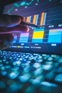tablet showing vibrant data dashboards and real-time stock analysis in business setting, suitable for fintech apps, investment platforms, data analytics tools, and business performance visualization