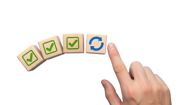 Hand gently pushing wooden blocks with checkmarks and a refresh symbol