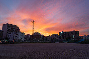 Sunset over Durr&euml;s city near the stadium.
Urban evening and travel concept. Copy space.
