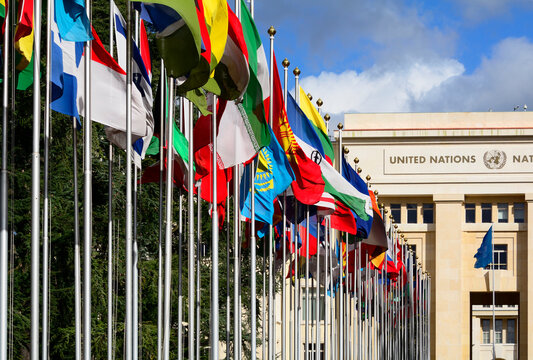 Geneva, Switzerland, Europe : Palace of Nations, national flags of the member states  in foreground, European Headquarters of United Nations, United Nations Office at Geneva (UNOG), Place des Nations