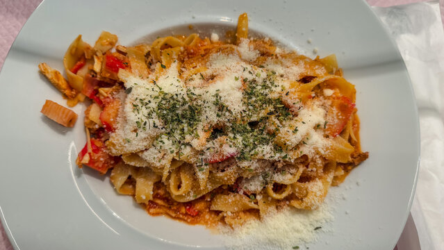 Pasta with chicken, seafood, ground beef, cheese, and oregano.