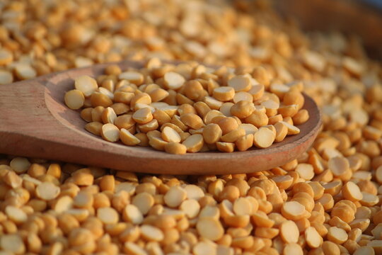 Toor dal is known as tur daal, yellow lentils split peas, indian split pigeon peas, arhar dal, tuvar dal, split peas, Yellow lentils, arahar daal, indian pulses. Concept of vegetarian protein food
