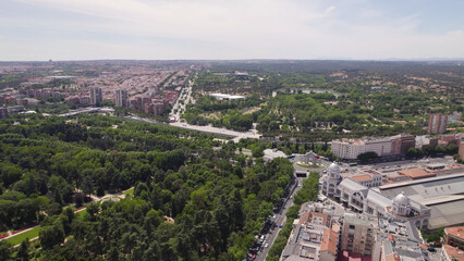 Fototapeta premium Aerial Drone View of Campo del Moro Gardens, San Vicente Gate, and Príncipe Pío Station, Madrid, Spain