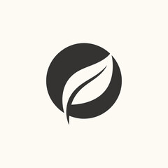 Minimalist Stylized White Leaf Logo Icon in Black Circle
