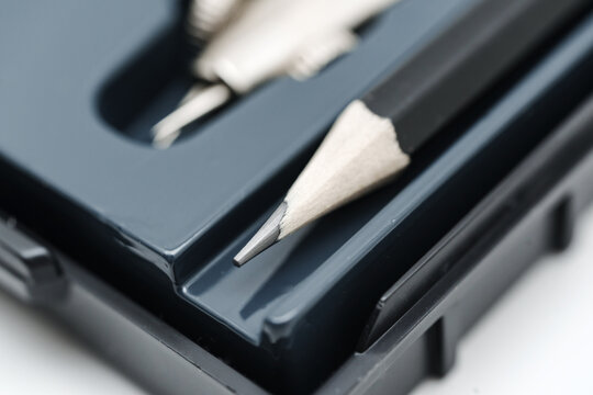 Close up of pencil and drawing tools in a black case on a table