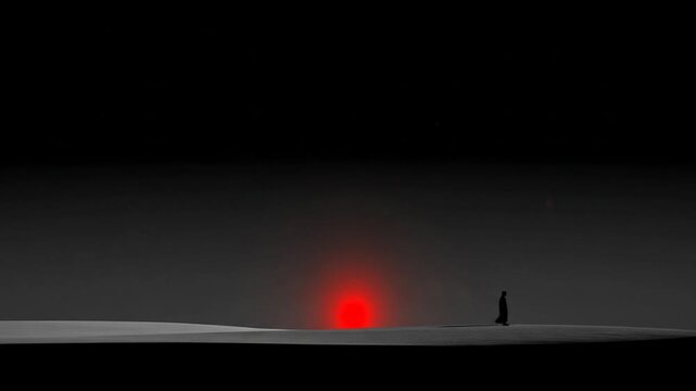 Silhouette figure standing before a glowing red orb against dark background