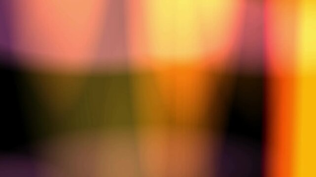 Abstract warm light leaks with orange and yellow glowing bokeh shapes moving on black seamless loop