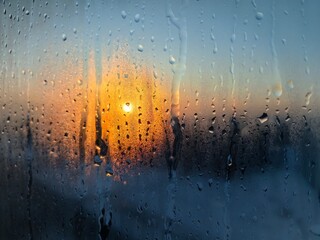 Frosty sunset behind the fogged glass.