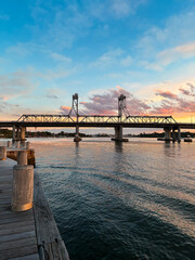 Fototapeta premium Beautiful sunset view of Ryde Bridge in Parramatta River, Sydney, Australia.