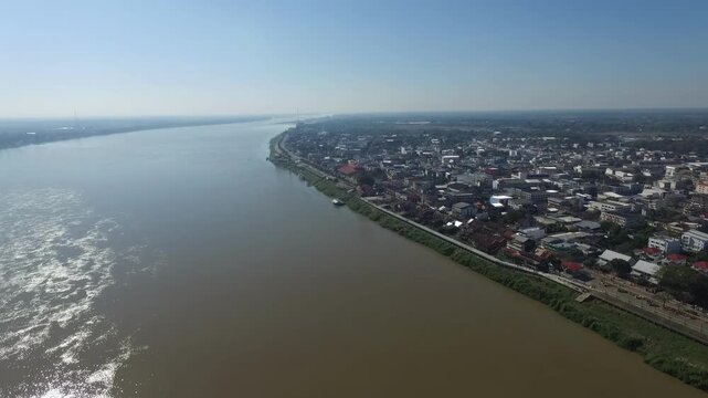 Aerial view of Nakhon Phanom city skyline along the Mekong River, Thailand.