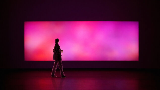 Vibrant artwork woman observing glowing abstract color panel. Concept of contemporary art exhibition, emotional perception, creative inspiration, modern editorial and branding visuals.