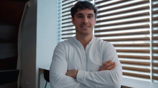 Portrait smiling happy Caucasian business man crossed hands crossing arms looking at camera smile joyful businessman 30s male employer guy confident manager startup owner project developer in office