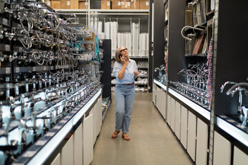 Searching for the right fixtures in a home improvement store on a busy afternoon