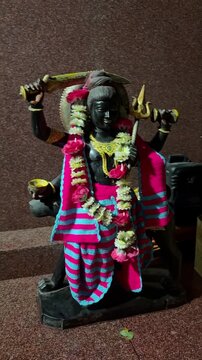 Shani Dev, the powerful Hindu deity associated with the planet Saturn and karmic justice, hindu temple.