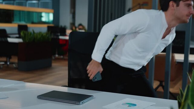 Tired Caucasian business man finish completing internet work closing laptop turning off light going away agent end of job done businessman male guy executive manager complete working in evening office