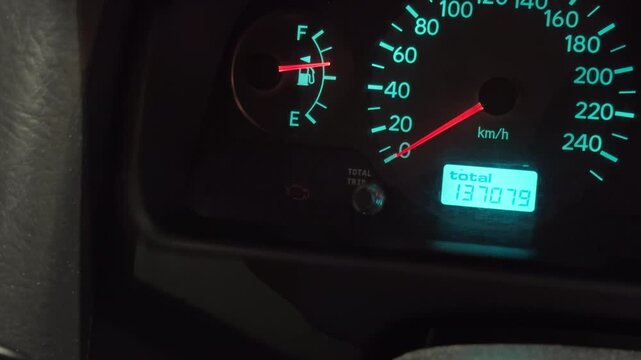 Car instrument panel showing empty fuel. Detailed image of car dashboard alerting low fuel level