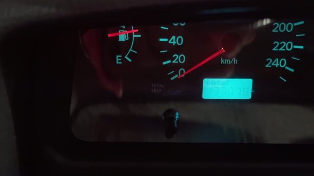 Vehicle gauges detailed. Instrument panel illuminated with reflective glare and needle positioning