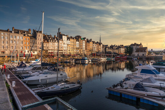 Sunset scenery in beautiful town of Honfleur in France with a little harbor 