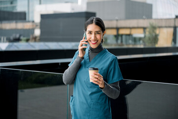 Fototapeta premium Healthcare professional talking on phone during break