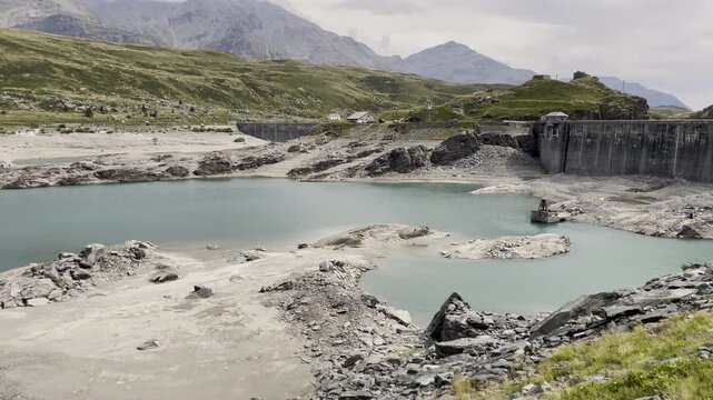 ontespluga Lake dam and reservoir landscape - 2022 drought in Italian Alps