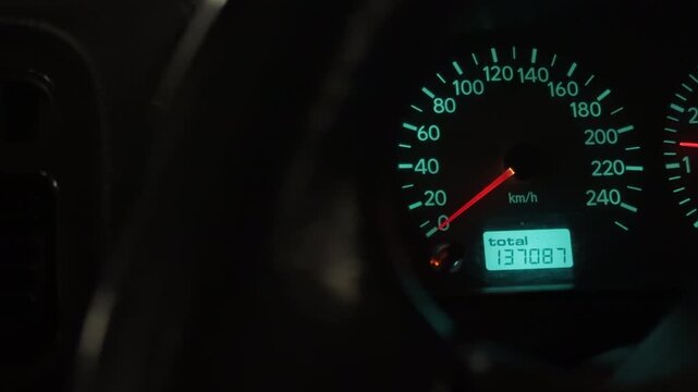 Nighttime car interior mood. Illuminated dash with gauges fosters concentration during nocturnal travel