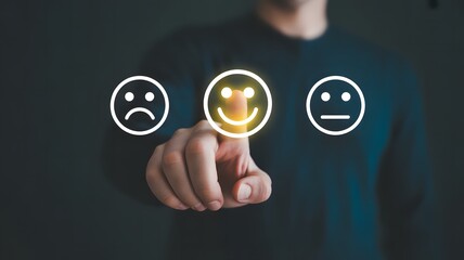 Fototapeta premium Person's finger touching a glowing smiley face icon, indicating positive customer satisfaction.