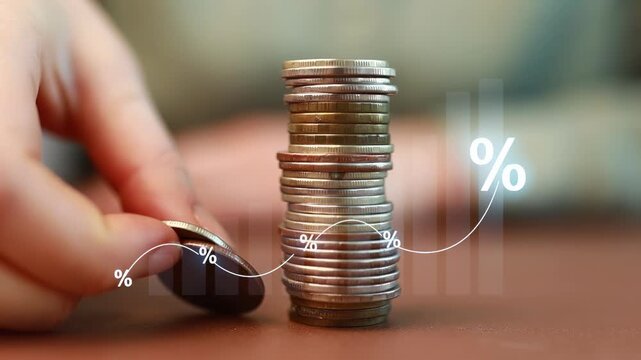 Stacking coins shows growth and financial planning in a simple setting with clear focus on money management.