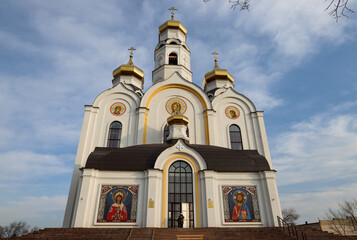 Fototapeta premium Plast, Russia - November 15, 2025: A woman enters the Orthodox Church of the Holy Great Martyr Barbara