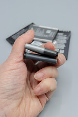 Bulging, old phone batteries. They are serious fire hazard. Immediately stop using the device, do not charge it, and dispose of the battery safely. Empty space for text.