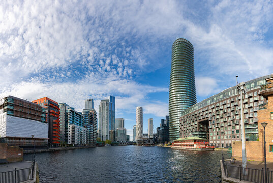 London, United Kingdom - April 19, 2025: A picture of the modern apartments and offices at the Isle of Dogs and Canary Wharf seen from the Millwall Inner Dock.
