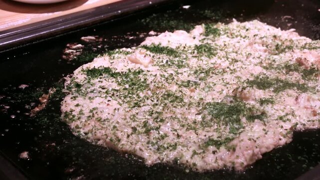 Monja, short for Monjayaki, is a savory, pan-fried Japanese batter dish